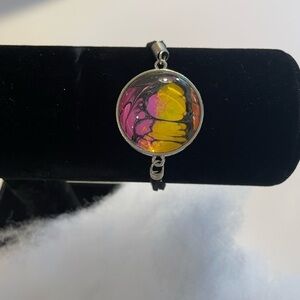 Hand painted acrylic design on glass & attached to metal backing